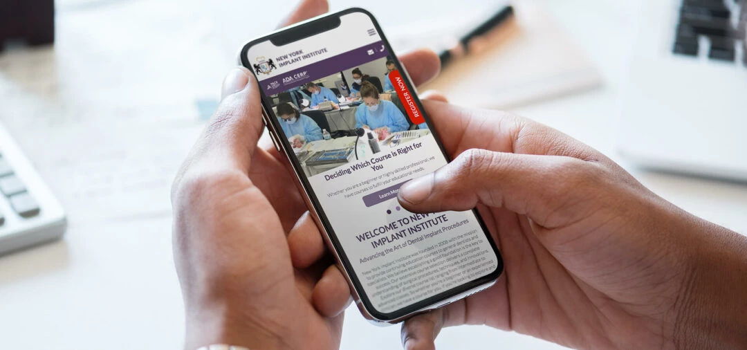 New York Implant Institute website on a mobile phone